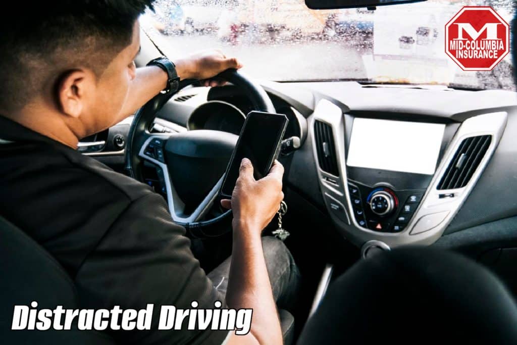 Person holding the cell phone and with the other hand the steering wheel, Distracted driver using the cell phone while driving, Man using his phone while driving, Concept of irresponsible driving