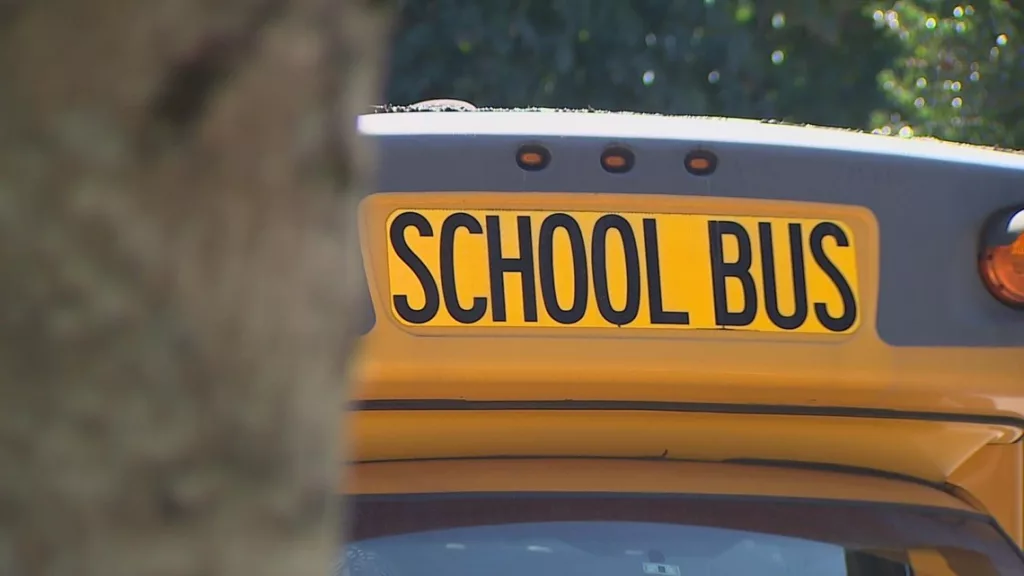 When do I need to stop for a school bus in Washington state?